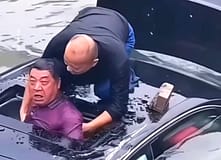 Dois heróis saltam ao rio: momento impressionante salva condutor de afogamento após despiste na China